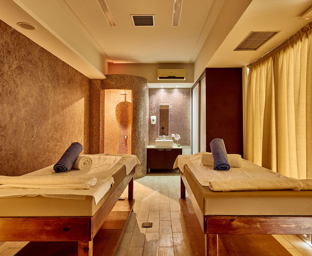 Paralos Kosta Alimia Spa room with two massage beds, decorations and amenities