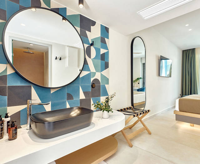 Paralos Kosta Alimia Double Room Swim Up Side Sea View washbasin, a round mirror and a pill mirror