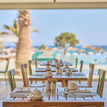 Paralos Kosta Alimia Breakfast decorated wooden tables and chairs