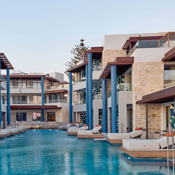 Paralos Kosta Alimia pool with sunbeds and the hotel