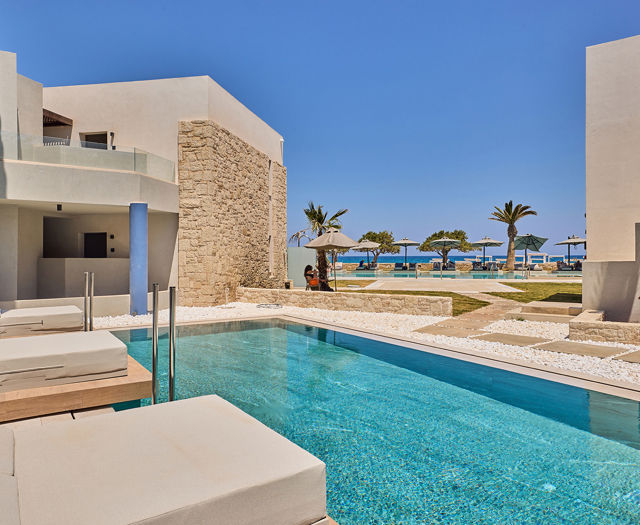 Paralos Kosta Alimia small pool, double sunbeds and a white stone path