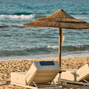 Paralos Kosta Alimia beach sunbeds and umbrella