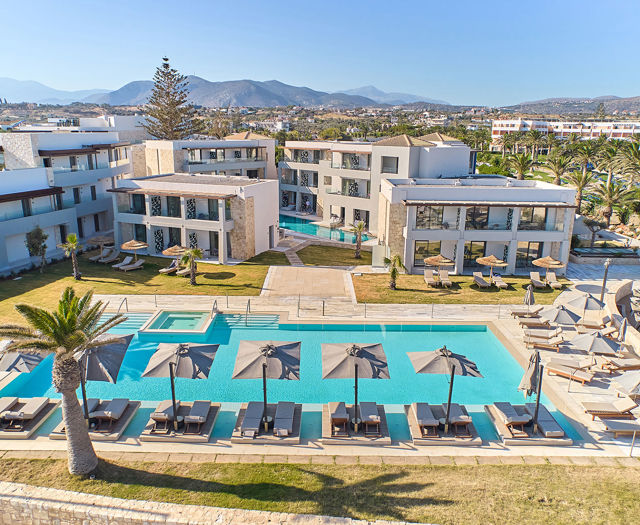 Paralos Kosta Alimia landscape view of the hotel and the pool with sunbeds and umbrellas