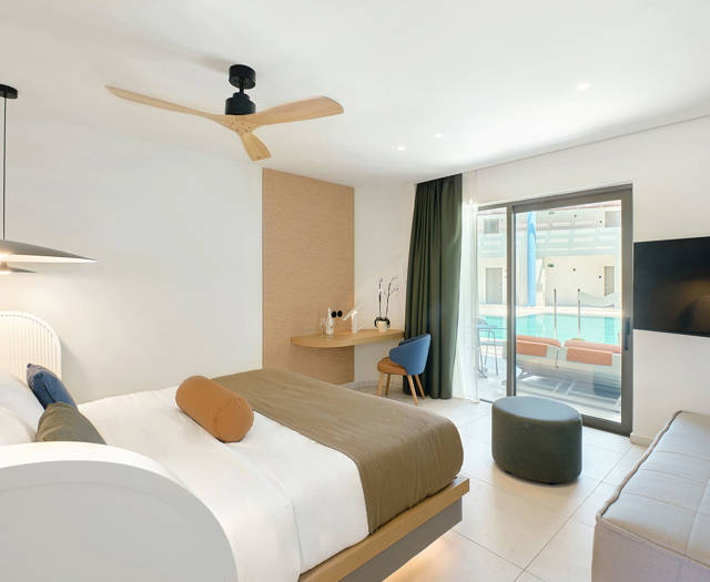 Paralos Kosta Alimia Junior Suite Swim Up bed, amenities and terrace view