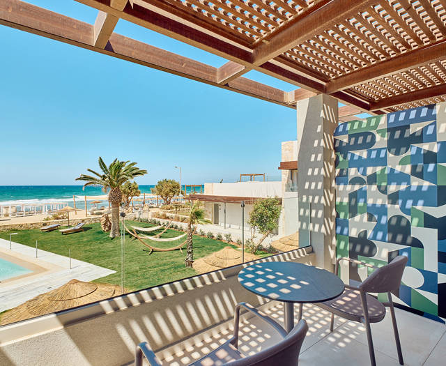 Paralos Kosta Alimia Double Room Direct Sea View balcony with a round table, a pair of chairs and view of the sea