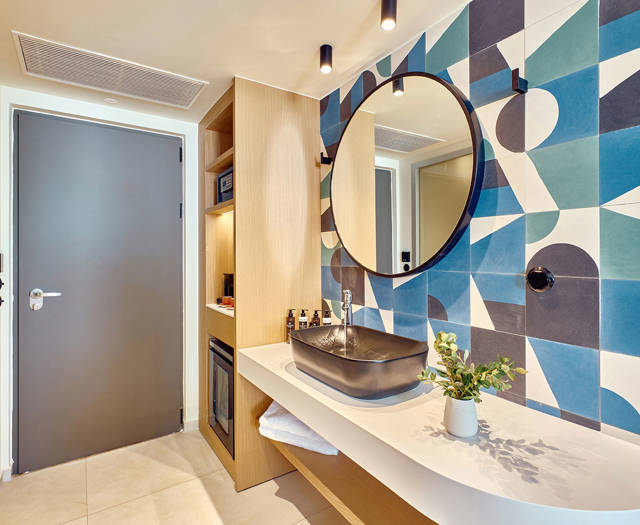 Paralos Kosta Alimia Double Room Swim Up Side Sea View washbasin, a round mirror and amenities